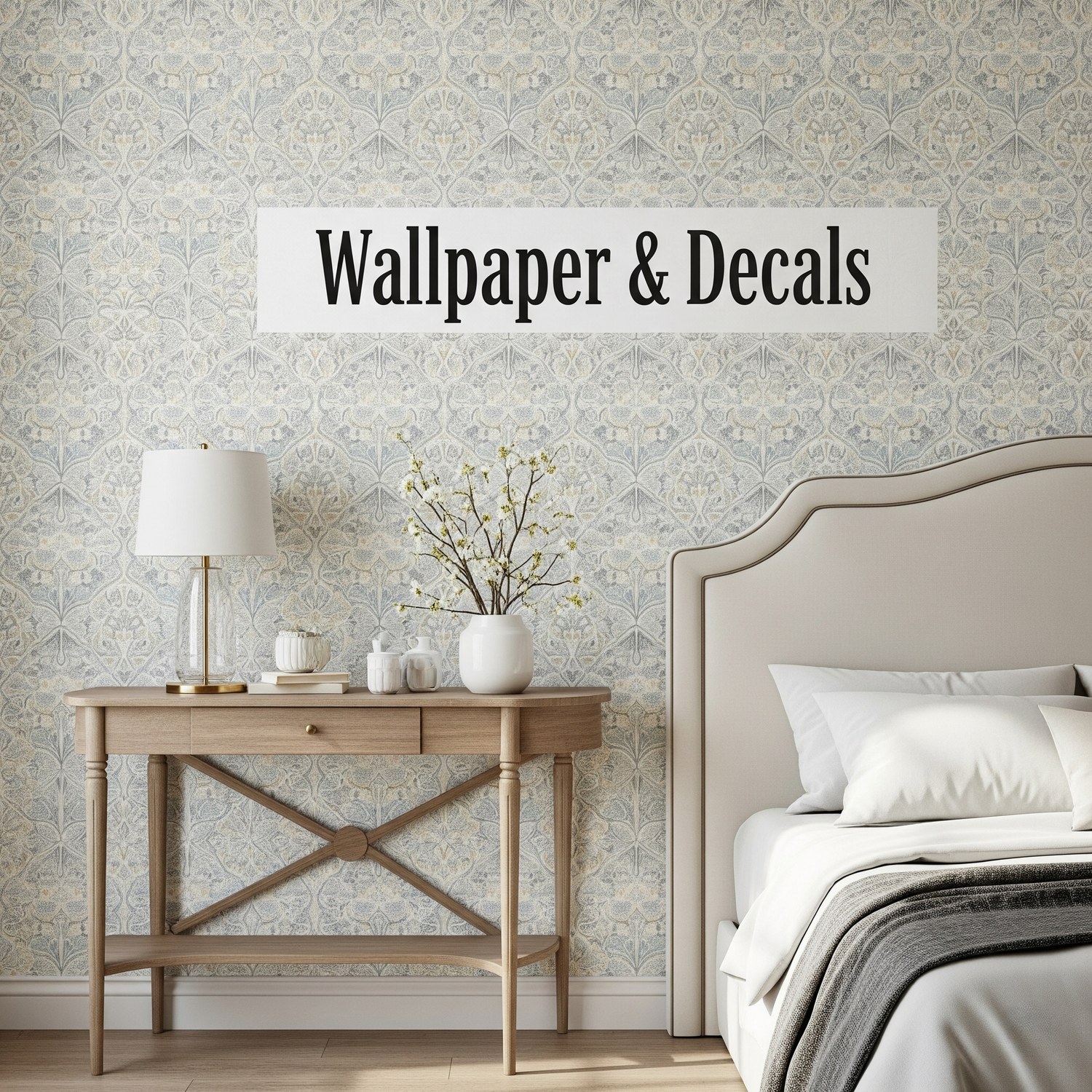 A close-up shot of a feature wall with patterned wallpaper behind a bed and console table.